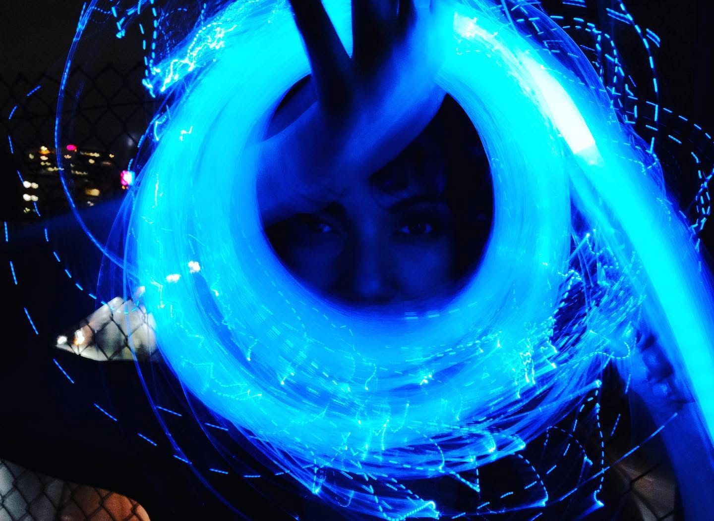 Long-exposure blue light swirl portrait